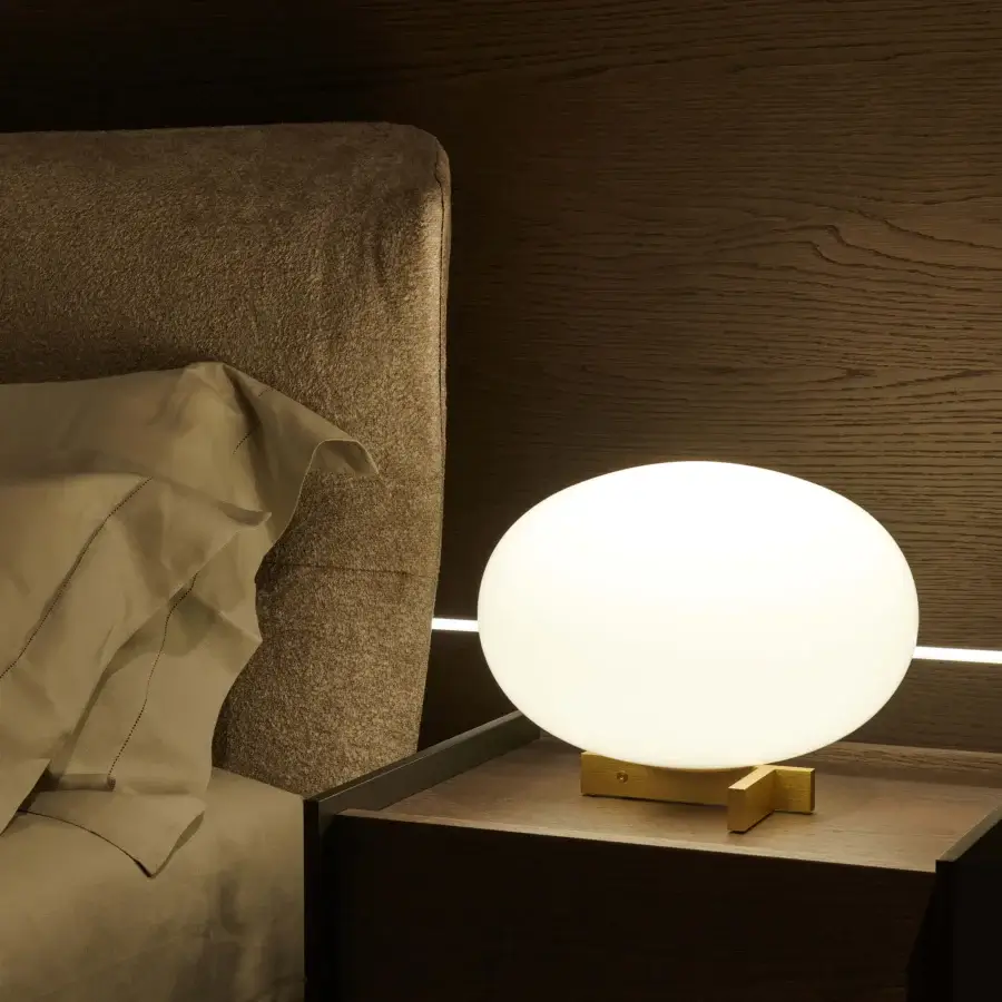 Distinguished Oluce Alba table lamp with frosted glass sphere and polished golden-toned metal base crafted in Italy