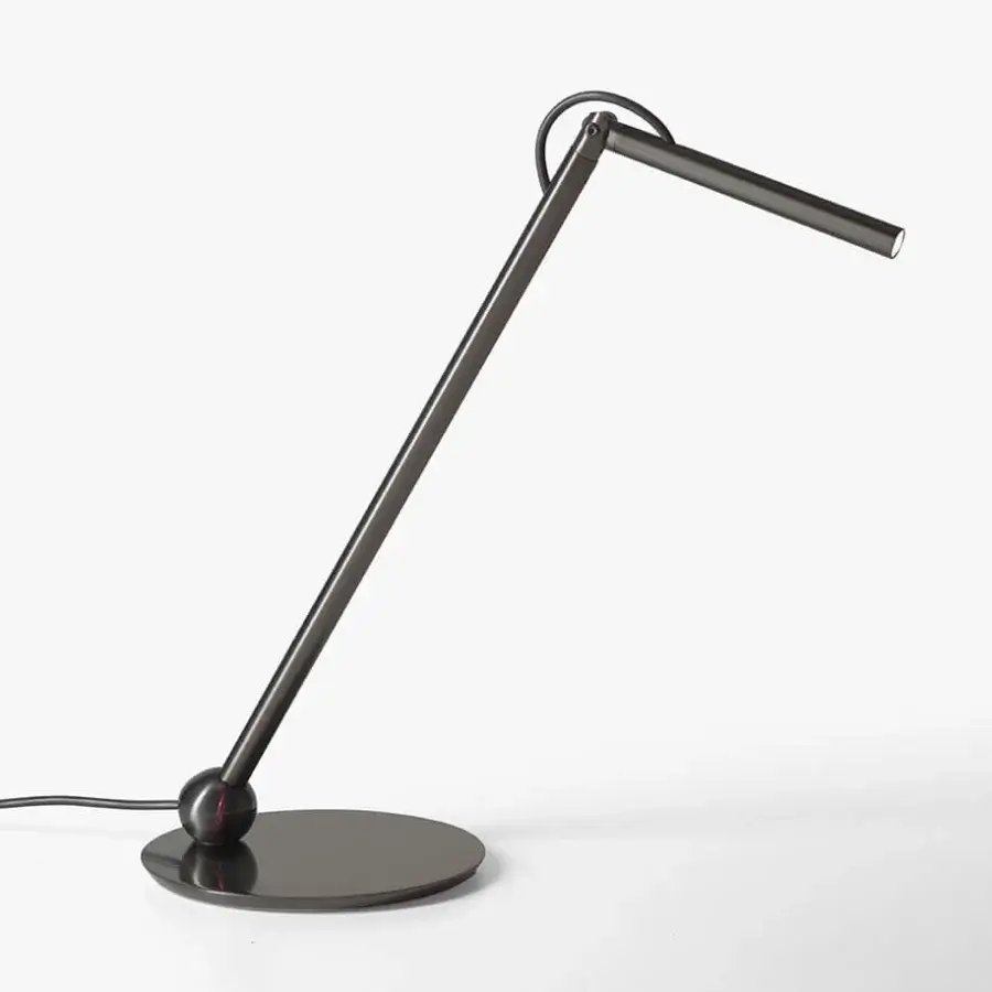 Distinguished Oluce Calamaio table lamp crafted of metal with a glossy dark gray lacquer finish and adjustable head