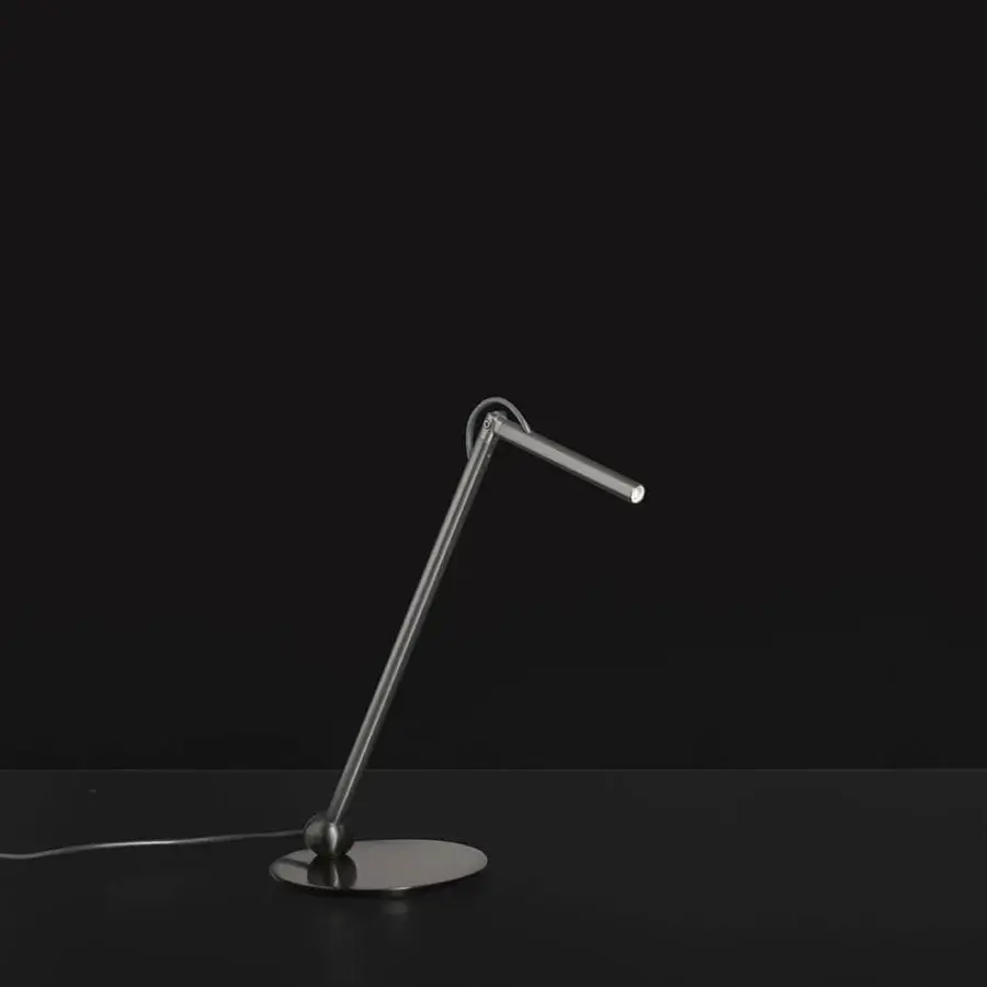 Superior Oluce Calamaio table lamp crafted from metal with a glossy black lacquer finish and adjustable form