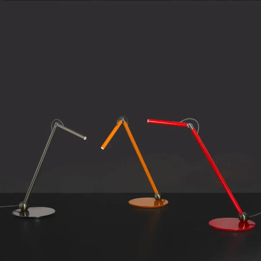 Distinguished Oluce Calamaio table lamp crafted from metal with a glossy red finish and adjustable head