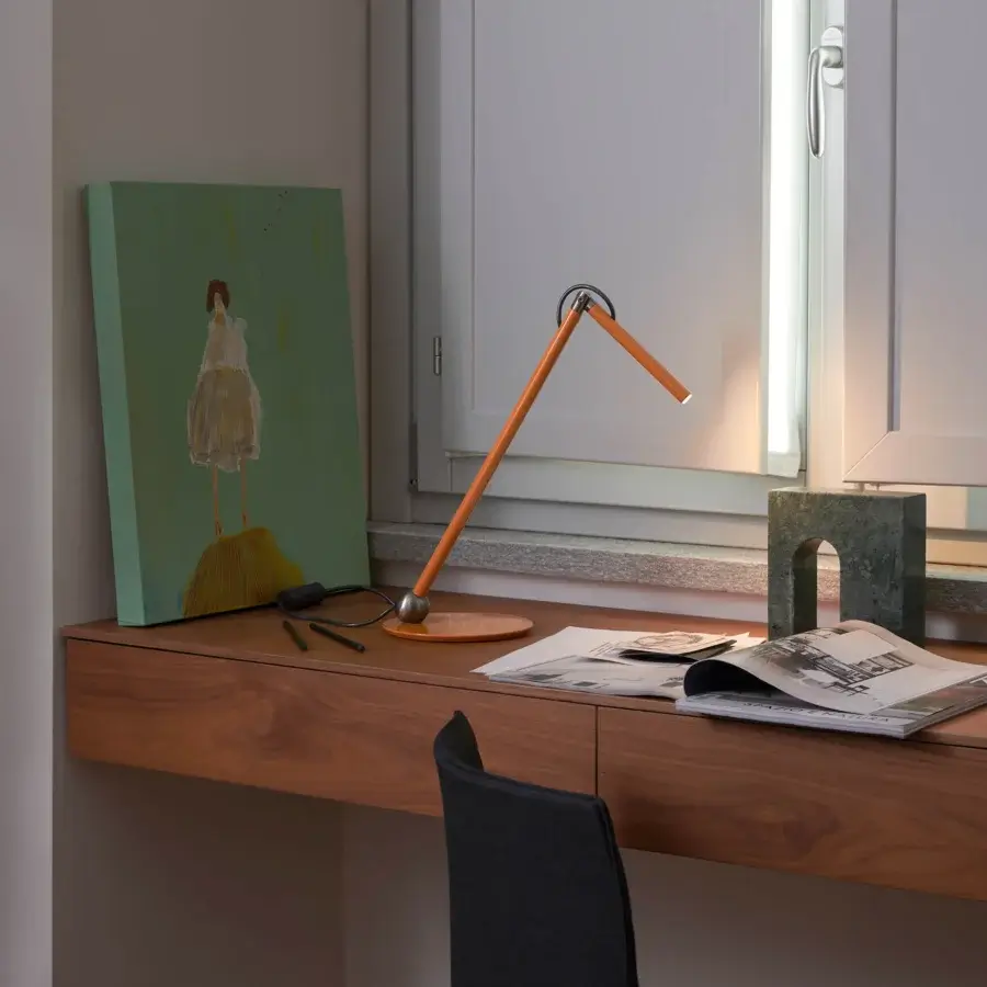 Distinctive Oluce Calamaio table lamp crafted from metal with a glossy orange lacquer finish and articulated form