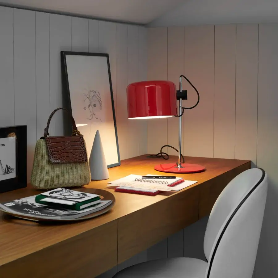 Distinguished Oluce Coupé lamp with sleek cylindrical form in glossy red and matte black metal construction