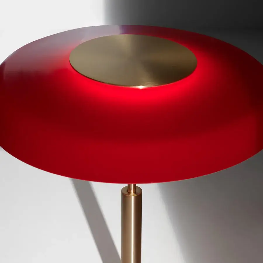 Exclusive Oluce Dora lamp embodies graceful form with a red glass lampshade and polished metal stem built with a golden inset