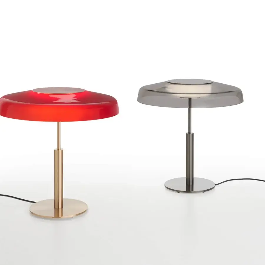 Distinguished Oluce Dora lamp embodies Italian design with a red glossy glass shade and gleaming gold-toned metal structure