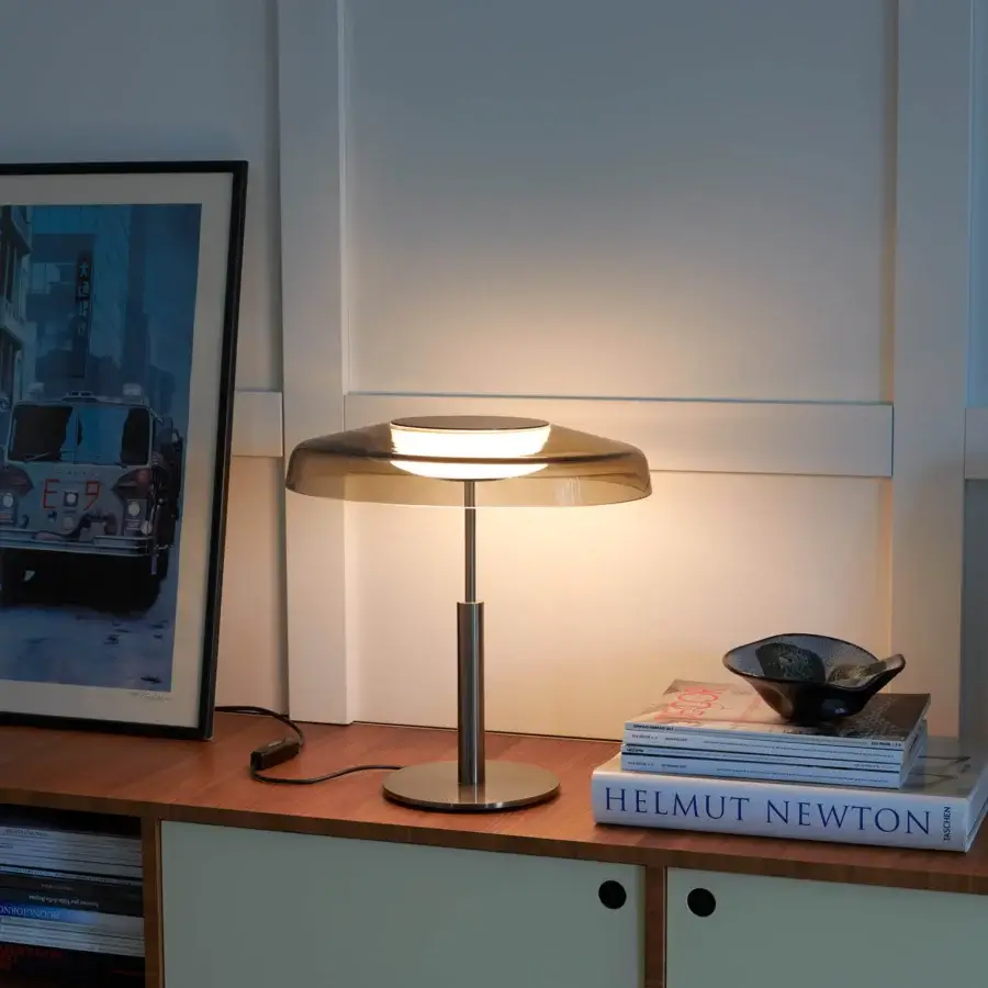 Exclusive Oluce Dora lamp embodies Italian design with a delicate glass cap lampshade and slender matte black metal stem
