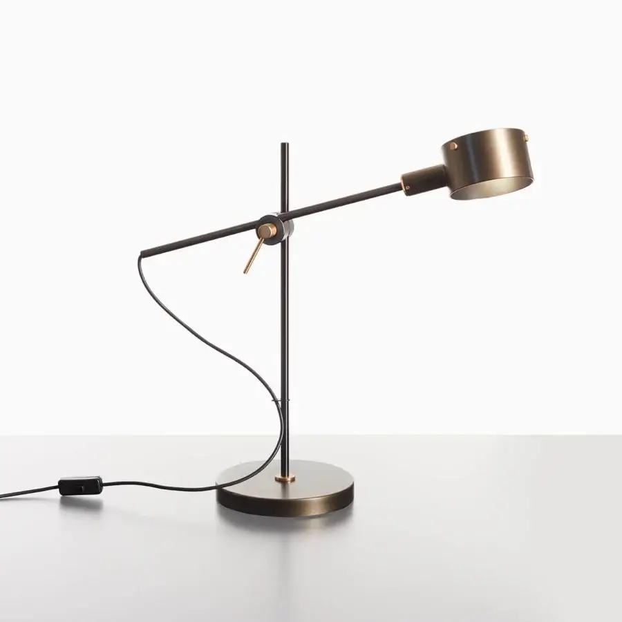 Distinguished Oluce G.O table lamp crafted in metal with a warm bronze finish and satin detailing