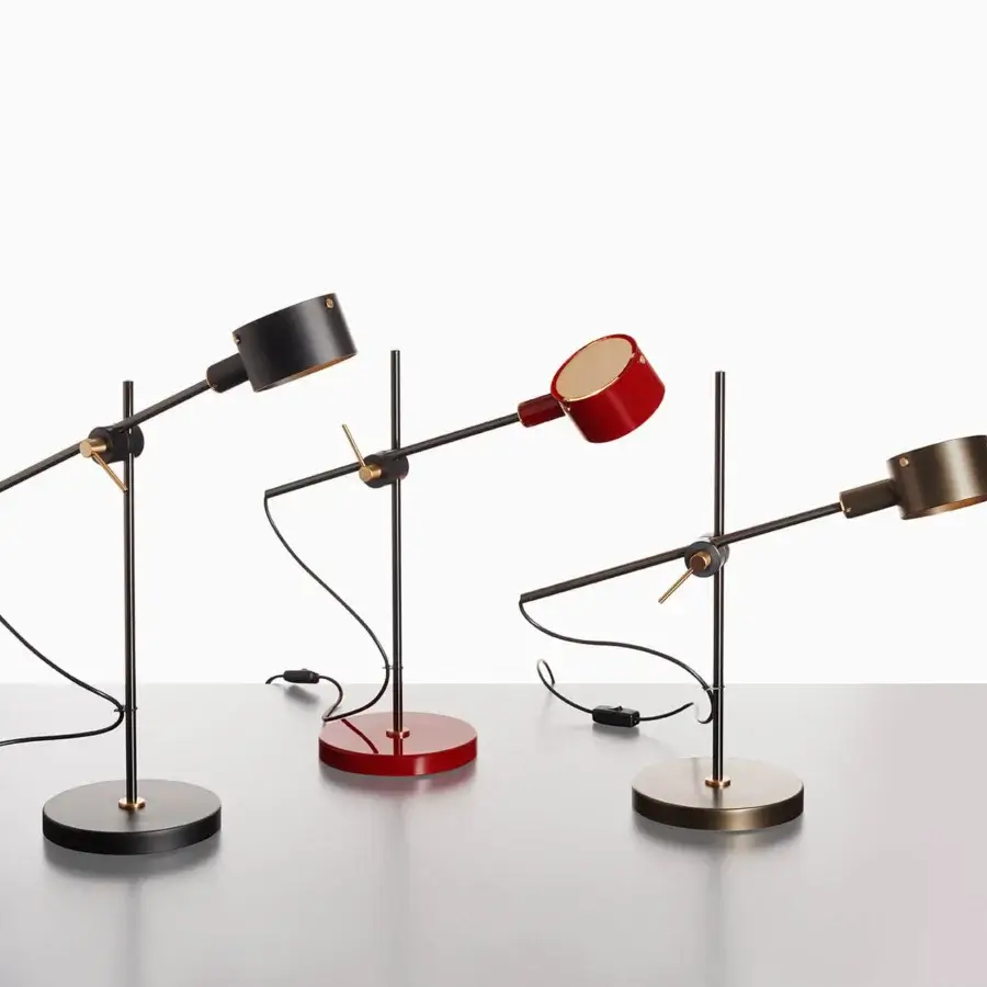 Luxury Oluce G.O table lamp crafted in red metal with a satin finish and adjustable arm