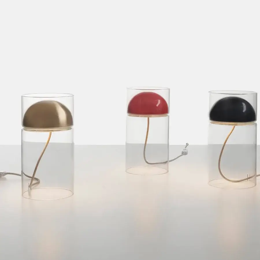 Elegant Oluce Medusa lamp crafted in transparent glass with a glossy red dome shade and polished metallic arm