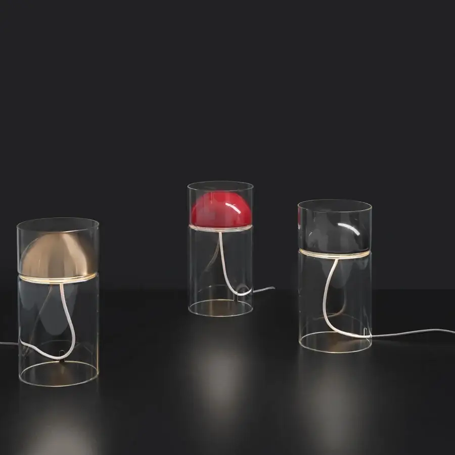 Superior Oluce Medusa lamp crafted in clear glass with a golden bell-shaped shade and descending white cord