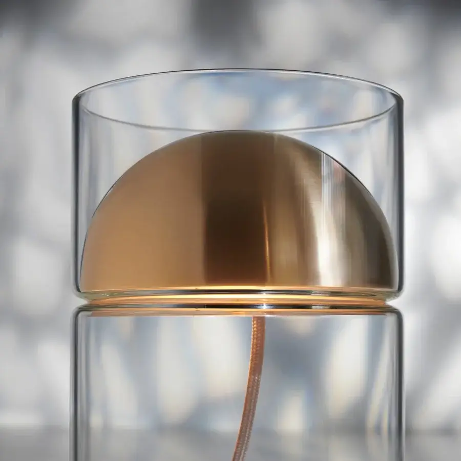 Distinguished Oluce Medusa lamp crafted in clear glass with a polished golden metal dome and descending electric cable