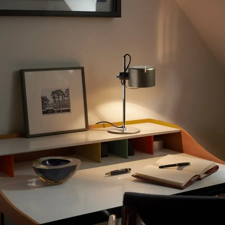 Exclusive Oluce Coupé lamp with a satin dark gray shade and polished silver-toned metal base offering directional light