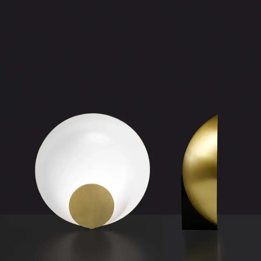 Exceptional Oluce Siro lamp with a translucent white glass body contrasted by a satin gold metal disc