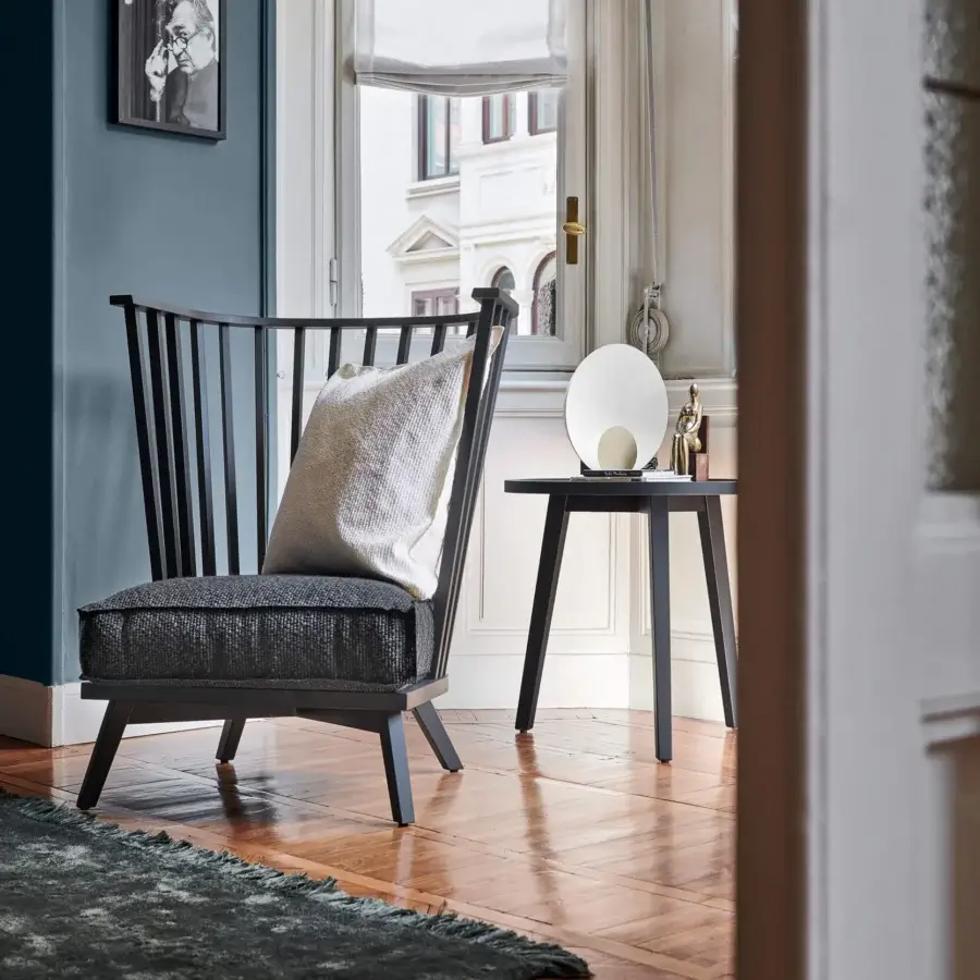 Exclusive Oluce Siro lamp with a semi-spherical white shade and satin dark-toned wood legs crafted in Italy