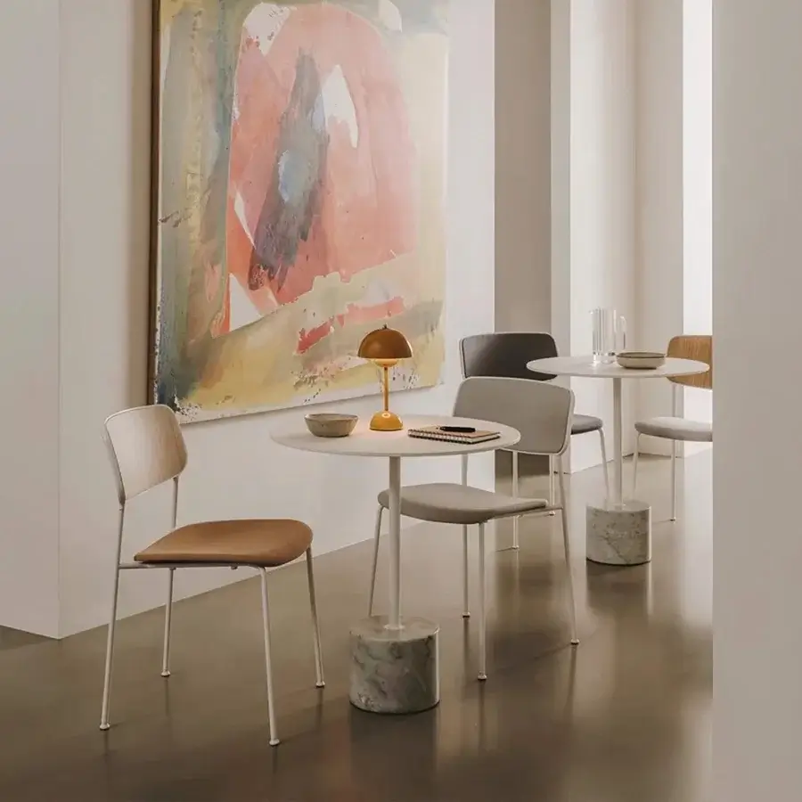 Distinguished Lapalma Jey table with a sleek circular matte white tabletop and marbled central pedestal base crafted in Italy