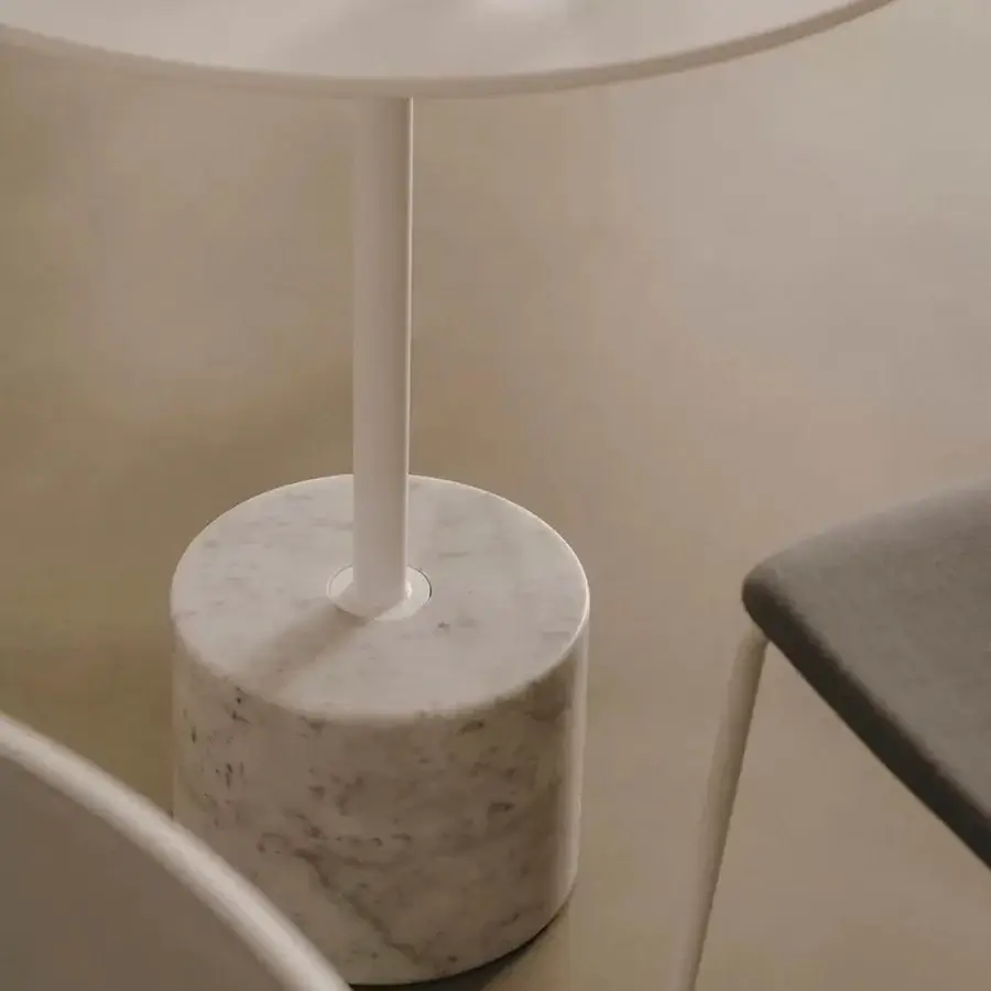 Elegant Lapalma Jey table with a light-toned tabletop and striking white marble base with grey veining in a smooth matte finish