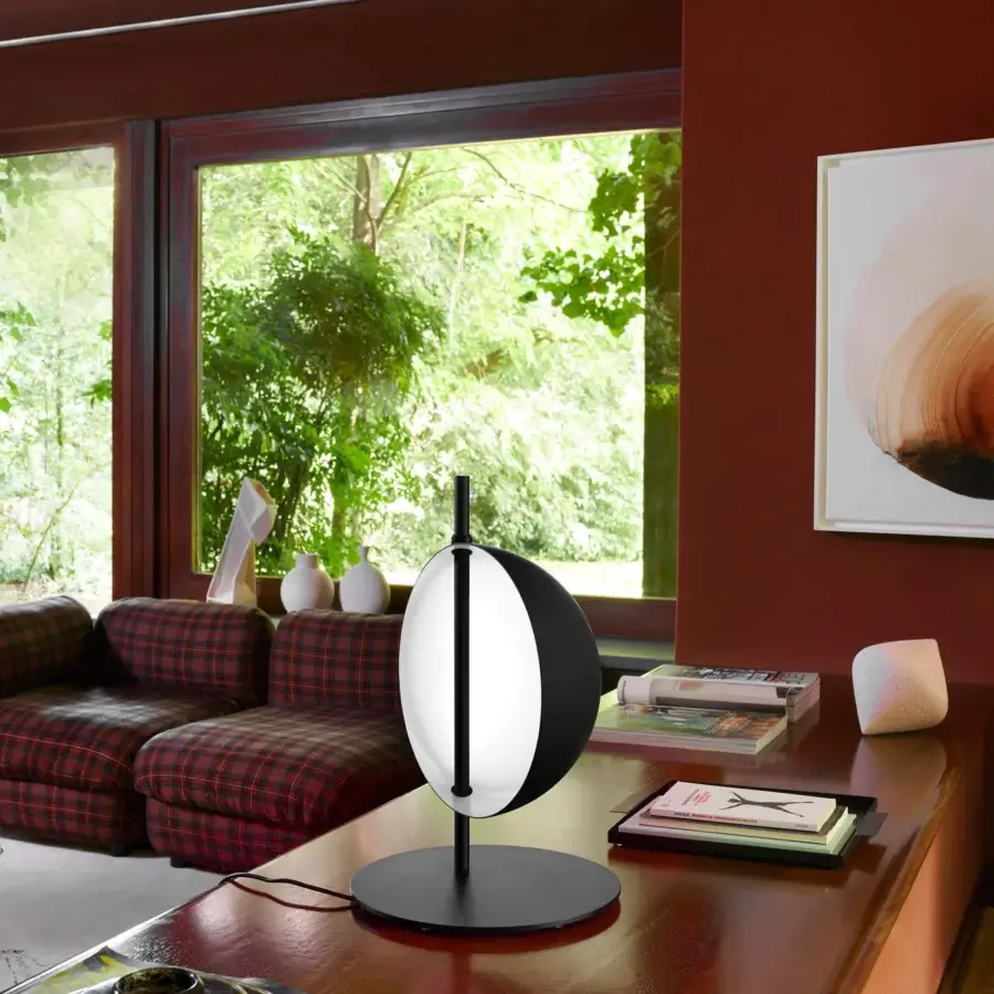 Elegant Oluce Superluna lamp crafted in white synthetic material with a matte dark metal stem and rotating reflector