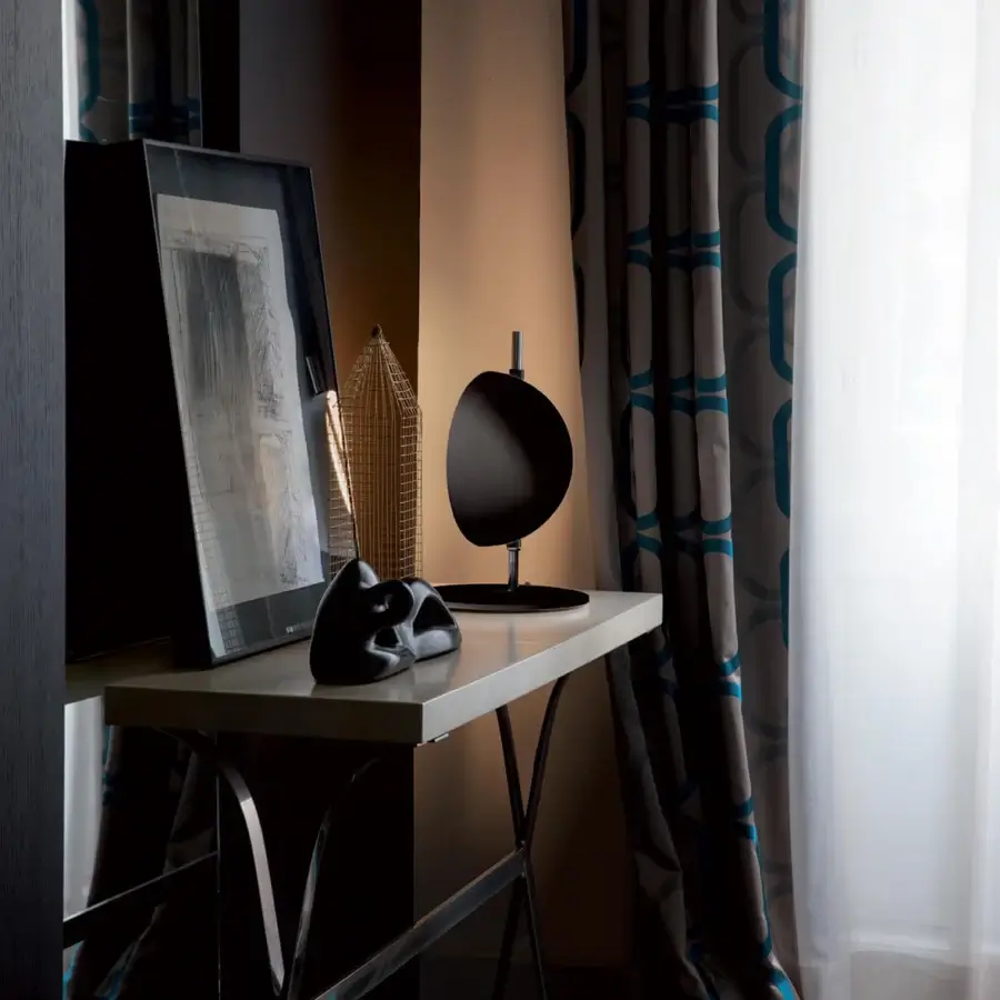 Exceptional Oluce Superluna lamp crafted in metal with a glossy dark gray to black finish evoking celestial movement