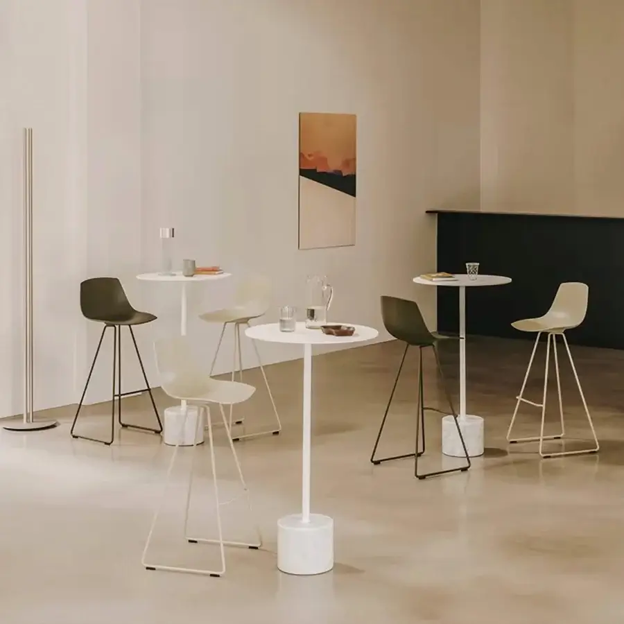 Refined Lapalma Jey Bistrot table with matte white synthetic material tabletop and subtly textured marble-like cylindrical base