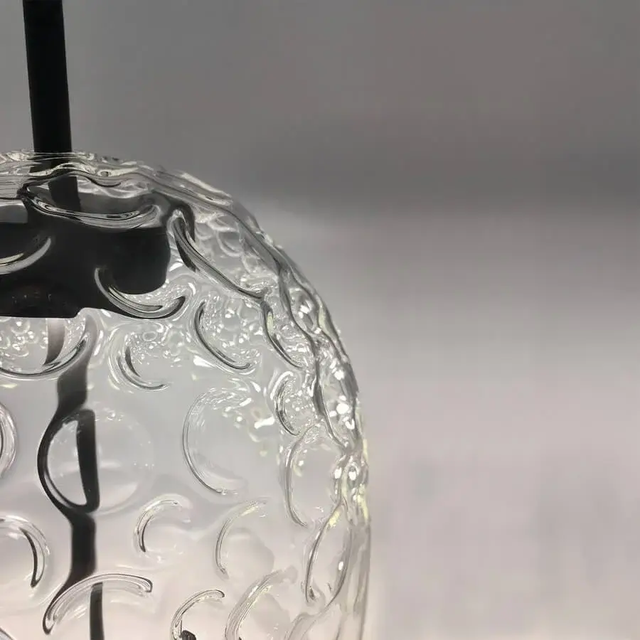 Elegant melogranoblu Galuchat table lamp with swirling transparent hand-blown glass and dark grey varnished metal structure