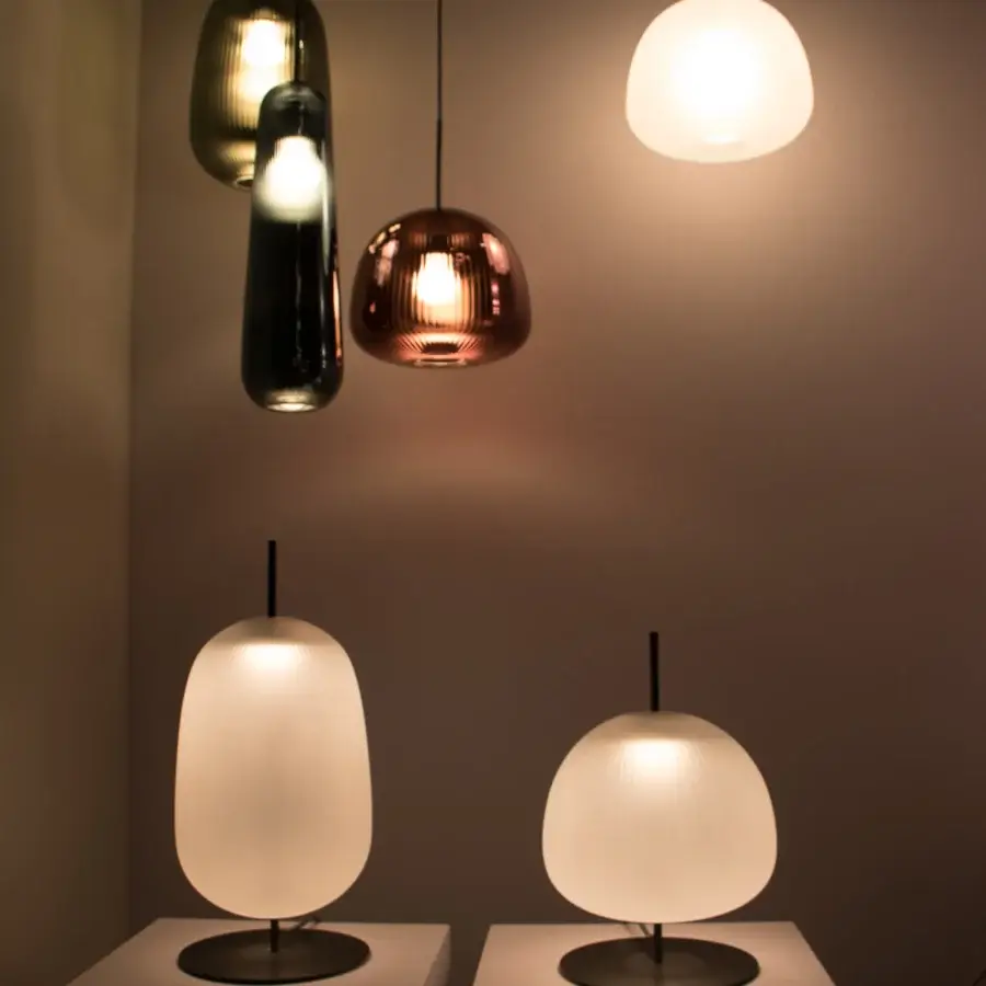 Distinguished melogranoblu Bes table lamp crafted in frosted creamy white hand-blown glass with a smooth matte metal base