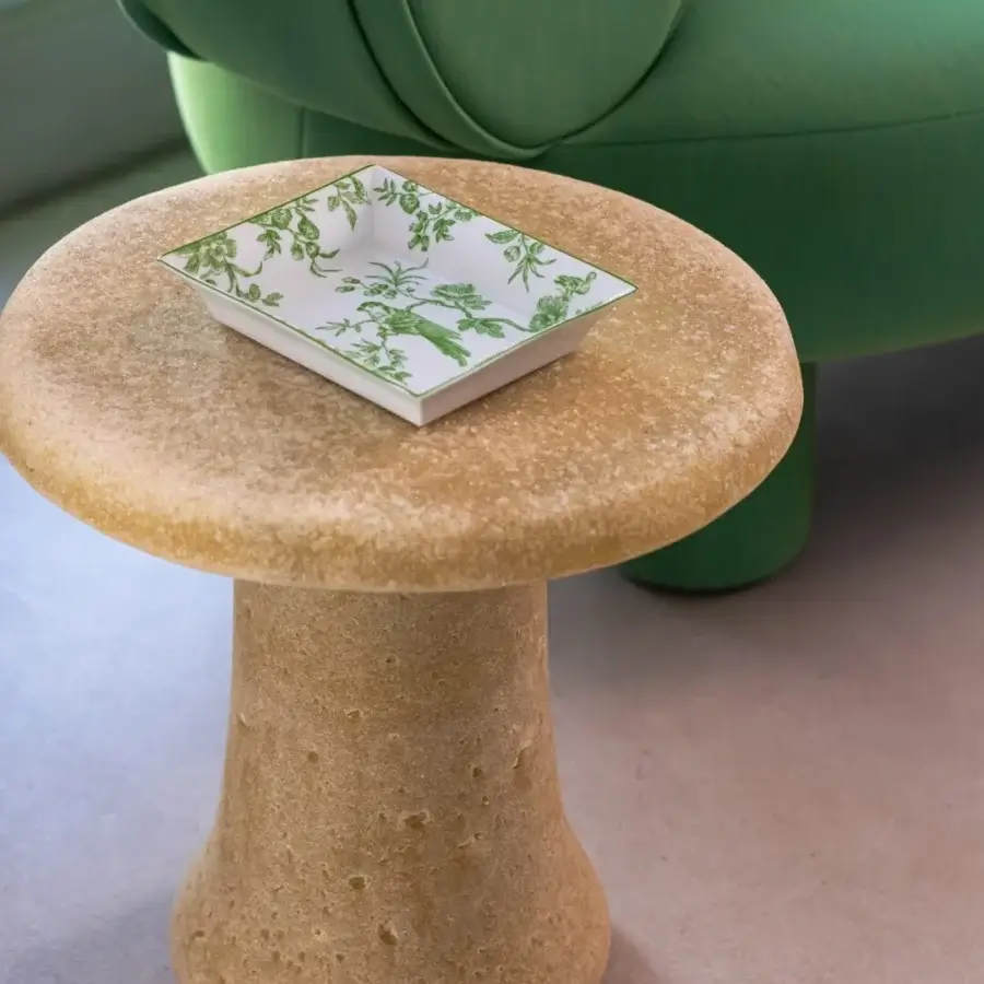 Luxury Glas Italia Babar table crafted in pale yellow-beige recycled glass grit with a subtly porous matte finish
