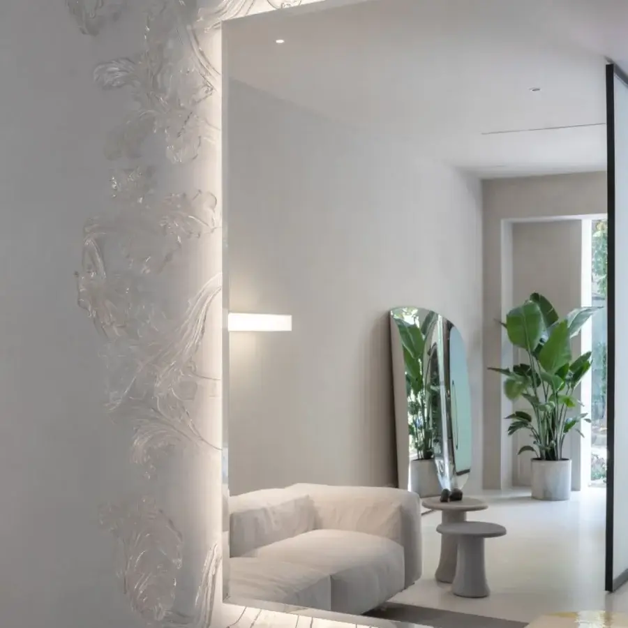 Distinguished Glas Italia Sturm und Drang mirror crafted with pale gray hand-made Murano glass and deeply embossed swirling relief finish