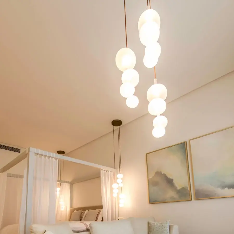 Superior melogranoblu Serendipity suspension lamp with cascading frosted glass spheres and light-colored metallic canopy