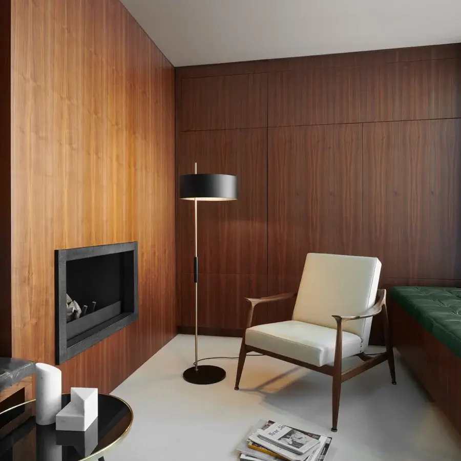 Elegant Oluce 1953 floor lamp with a black lampshade and satin gold stem crafted in Italy for refined style