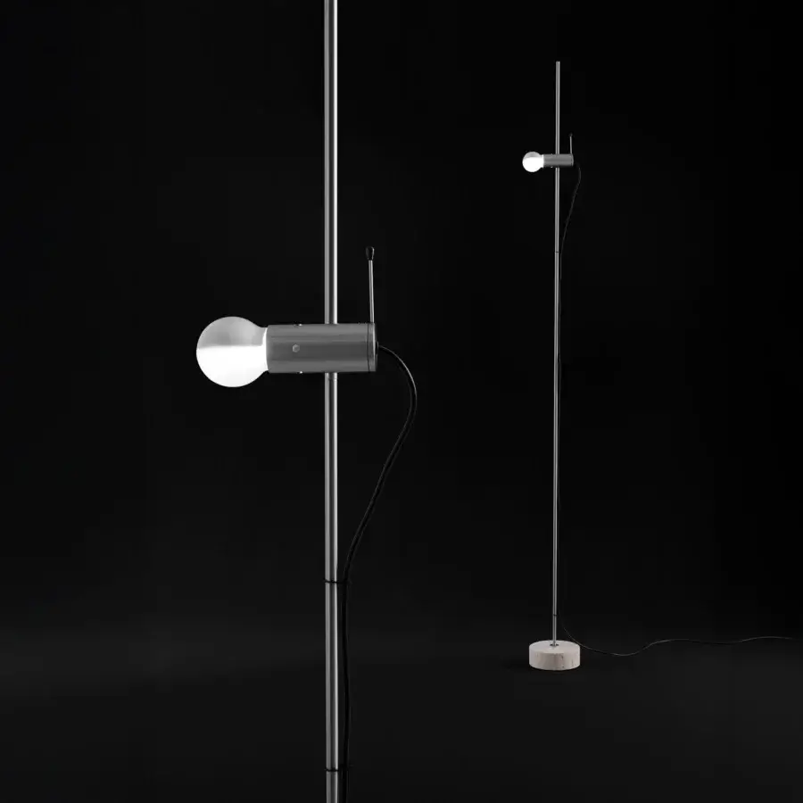 Distinguished Oluce Agnoli floor lamp crafted in neutral gray metal with a refined travertine base and innovative sliding mechanism