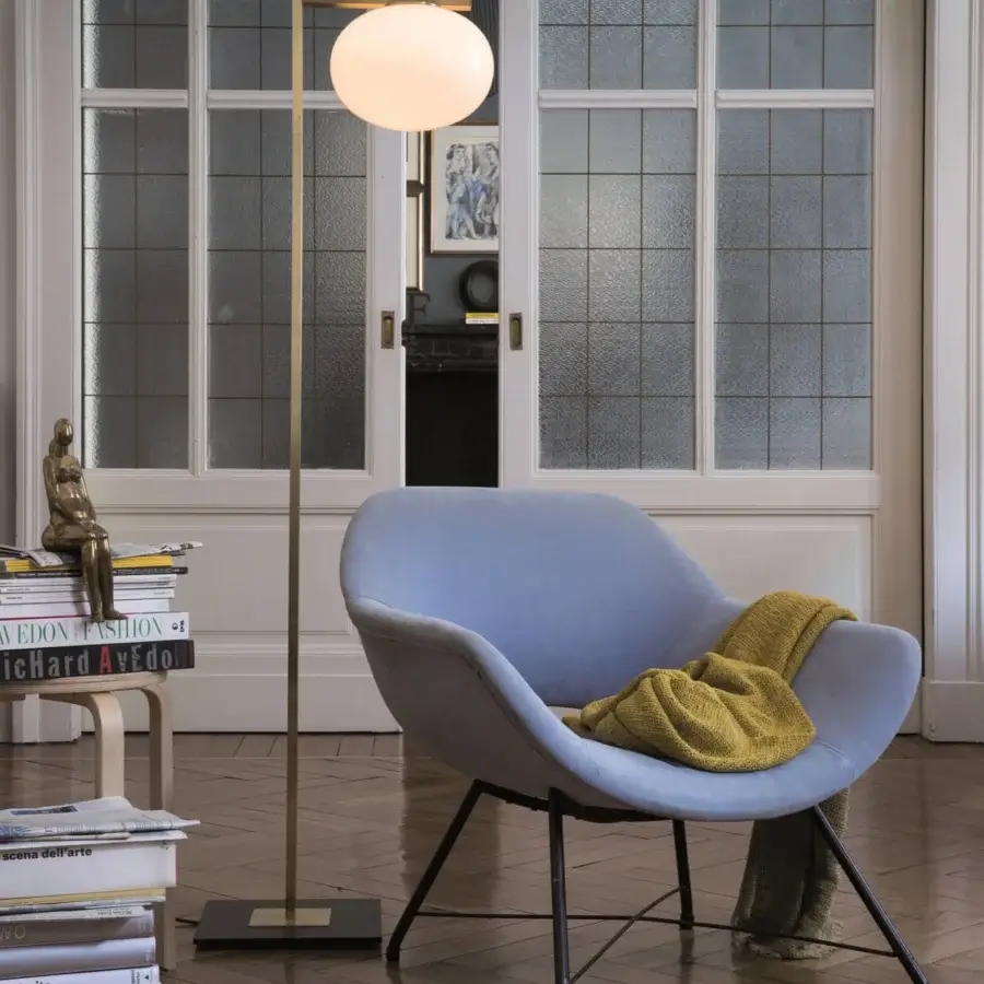 Exceptional Oluce Alba floor lamp with a warm gold satin finish and spherical lampshade crafted in Italy