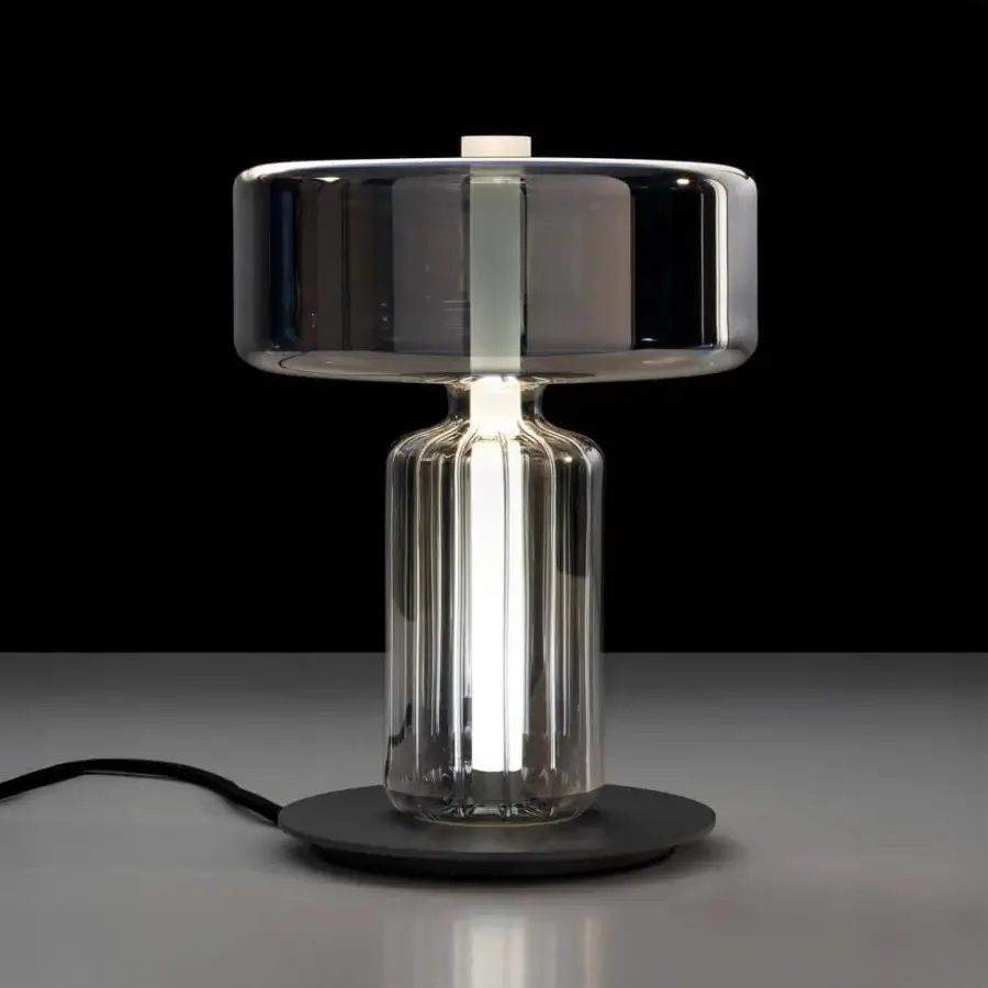 Captivating melogranoblu Rapanui table lamp crafted with vertically ribbed clear glass and a gradient smoky grey-blue shade in steel and gold finishes