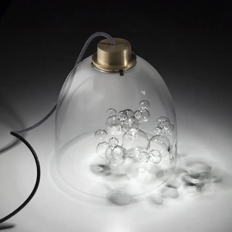 Distinguished melogranoblu Soap table lamp crafted in transparent hand-blown glass with delicate bubble glass sculpture and golden metal accents