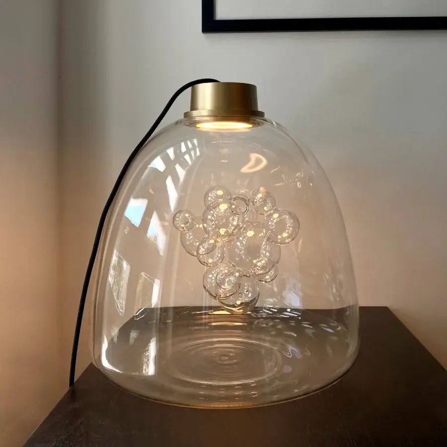 Superior melogranoblu Soap table lamp crafted in hand-blown transparent glass with a glossy golden-toned metal top and translucent spheres