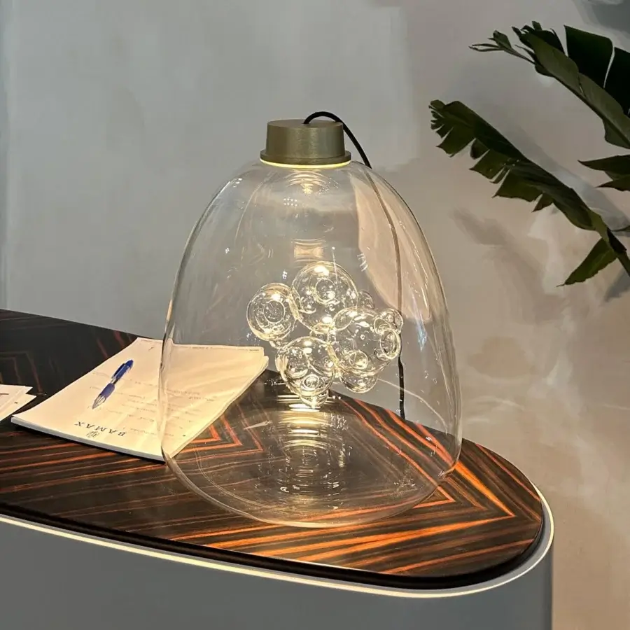 Exceptional melogranoblu Soap table lamp built in transparent glass with a brushed gold-toned metallic cap and glossy striped wood base