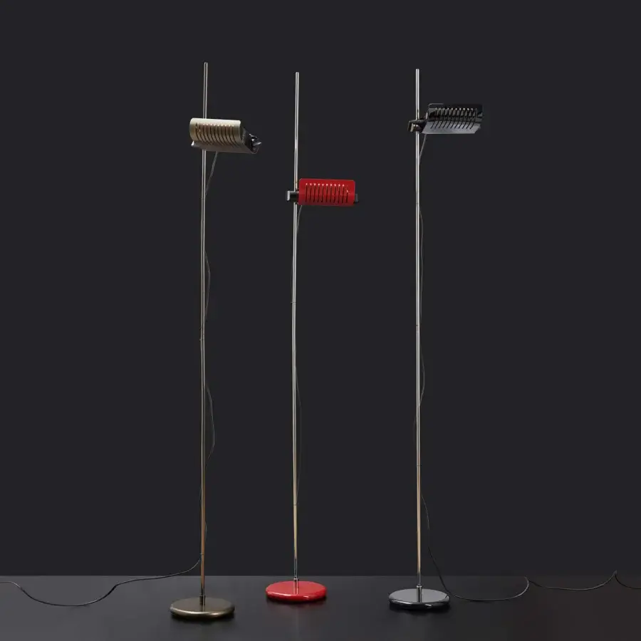Distinguished Oluce Colombo floor lamp with red circular base and rectangular polished metal shade featuring vertical slits