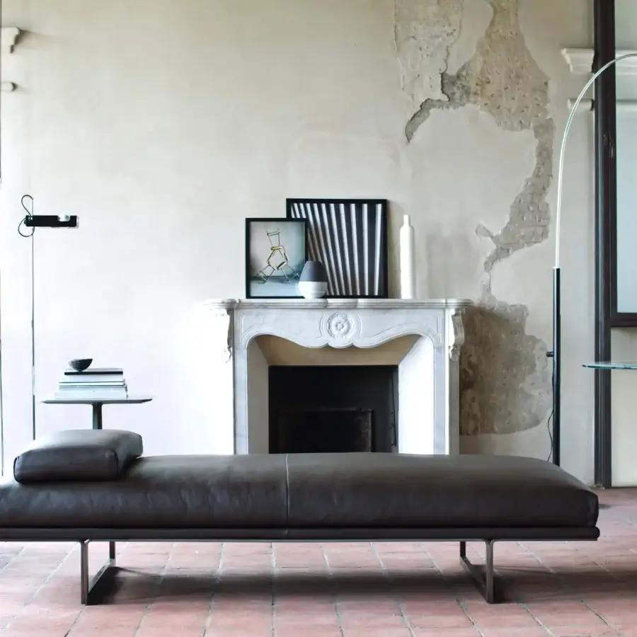 Timeless Oluce Coupé arched floor lamp crafted in Italy with a sleek metal frame and matte black finish