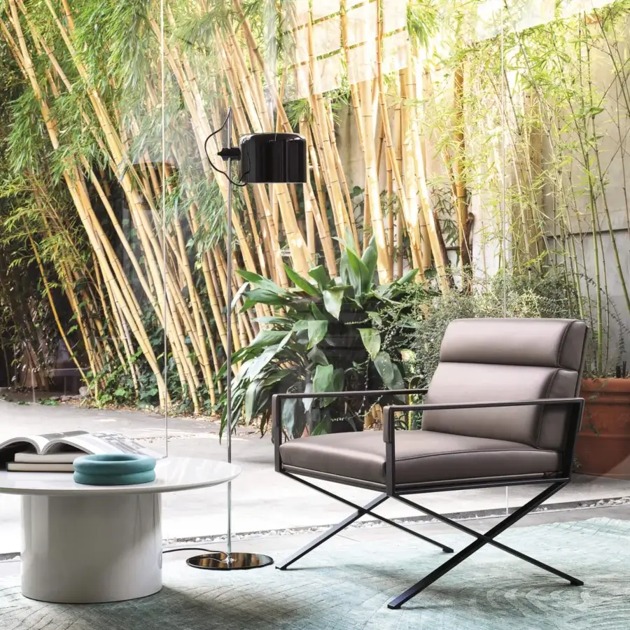 Distinguished Oluce Coupé floor lamp with a sleek matte black metal finish and adjustable coupe-shaped head
