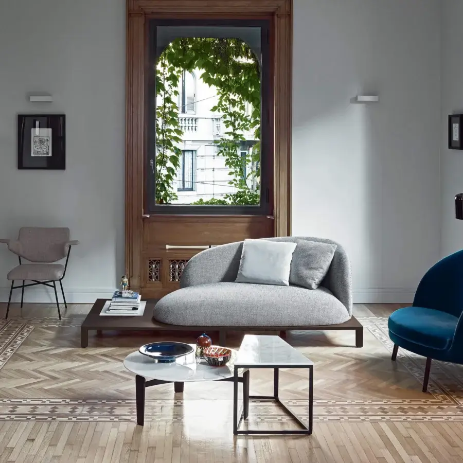 Timeless Oluce Coupé floor lamp crafted in metal with a sophisticated matte black finish and semi-spherical dome