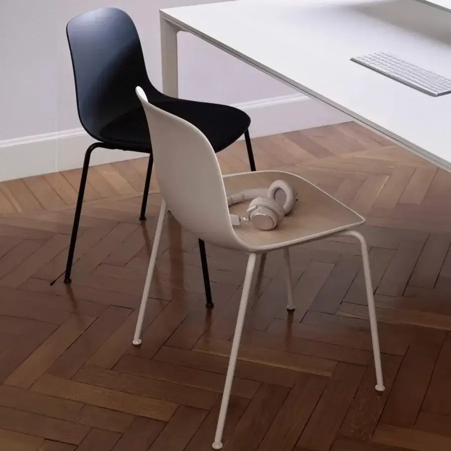 Sophisticated Lapalma Seela chair with organically curved form in pale beige and matte synthetic shell built with light metal legs