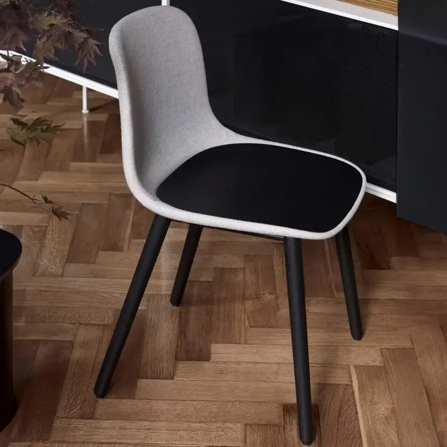 Superior Lapalma Seela chair with aerodynamic molded shell in matte light gray textile and contrasting black seat with dark metal legs