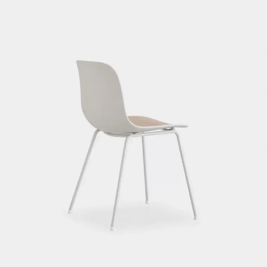 Superior Lapalma Seela chair with aerodynamic molded shell, wood insert, and slender white metal legs in a matte light gray-white finish