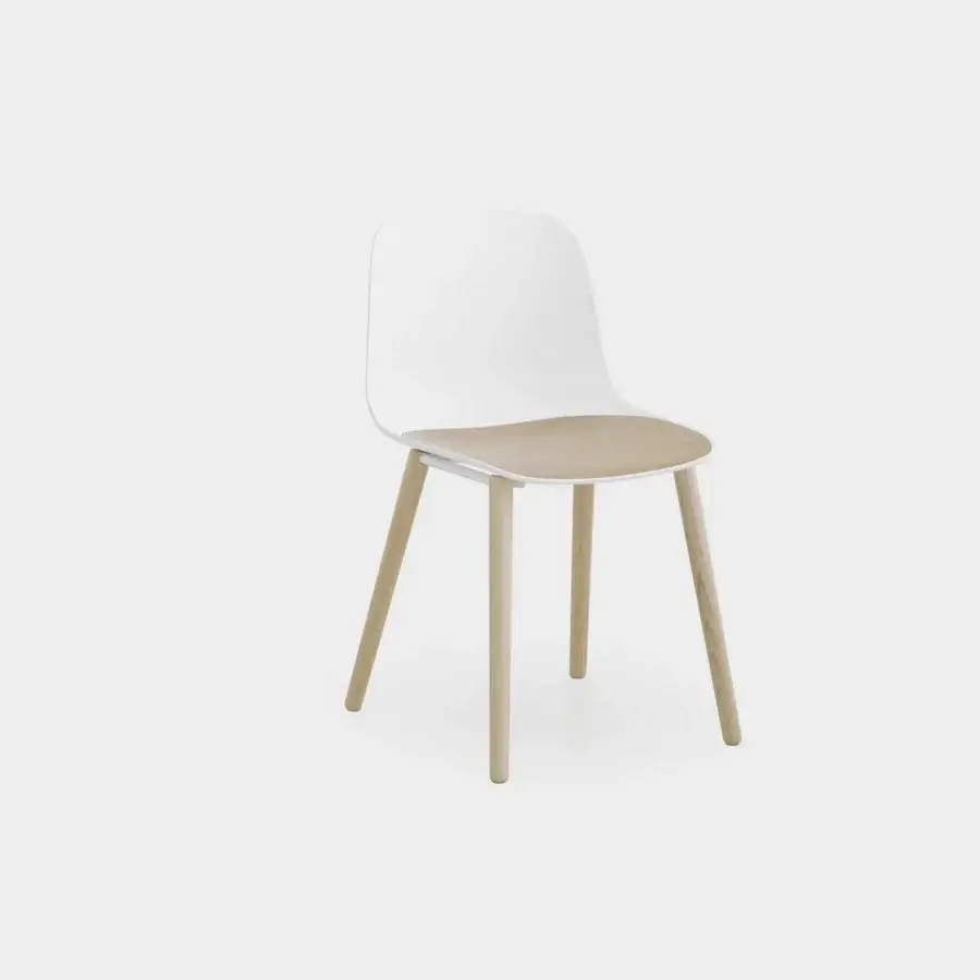 Sophisticated Lapalma Seela chair with aerodynamic design crafted in matte white plastic and light-toned wood support