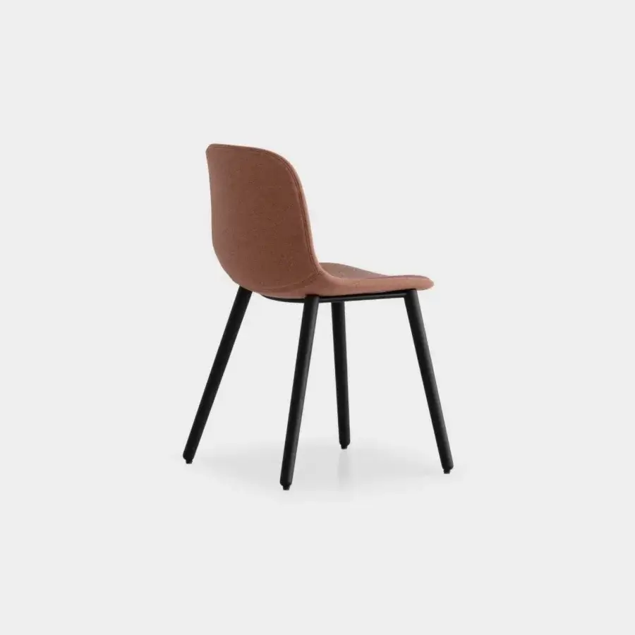 Exceptional Lapalma Seela chair with aerodynamic design upholstered in muted terracotta fabric and dark matte metal frame