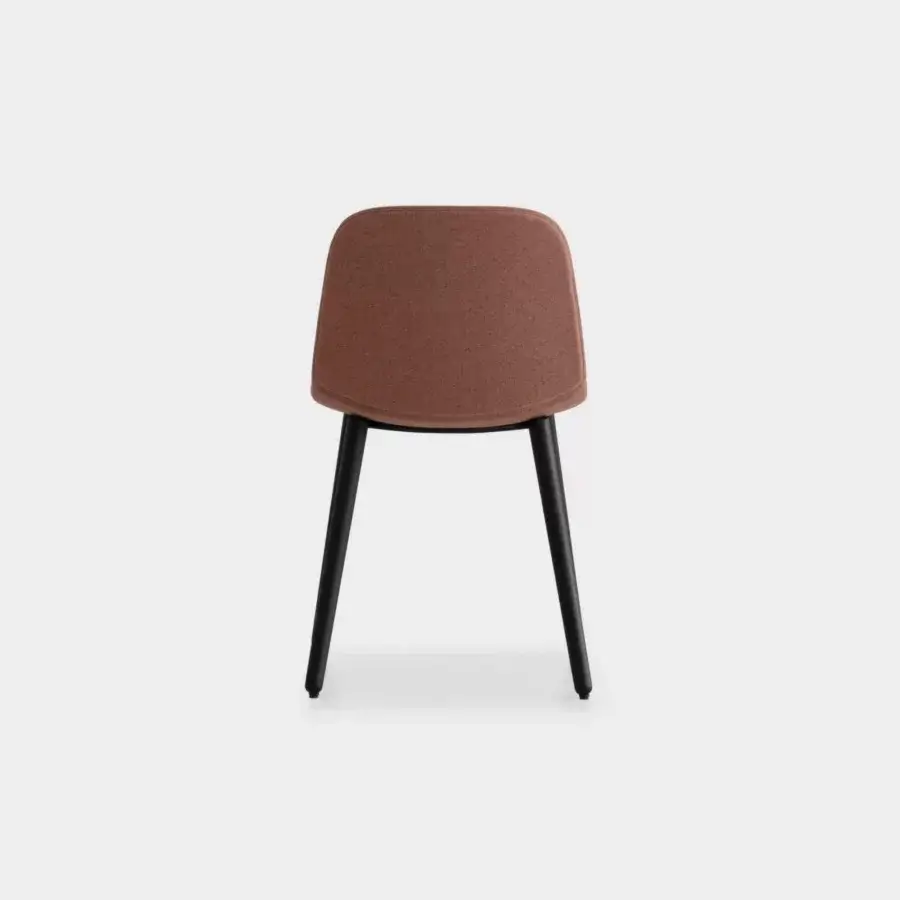 Distinguished Lapalma Seela chair with aerodynamic form upholstered in textured reddish-brown fabric and sleek matte black metal legs