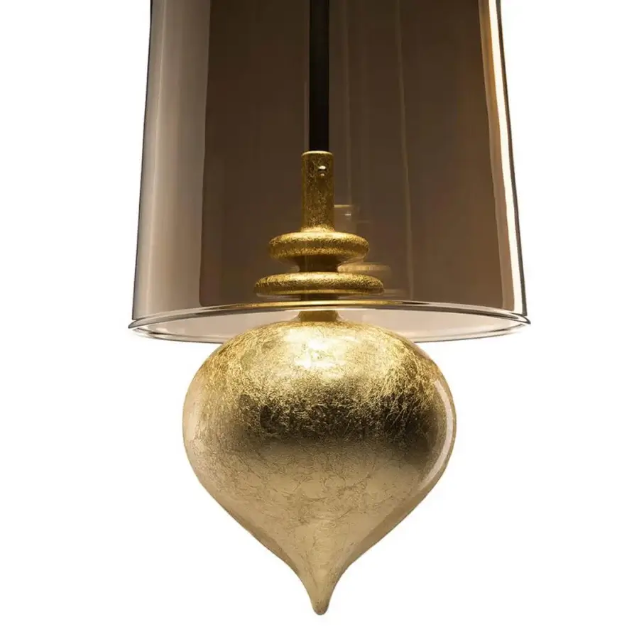 Distinguished melogranoblu Ghanta suspension lamp crafted in hand-blown amber glass with delicate gold leaf and dark grey metal accents