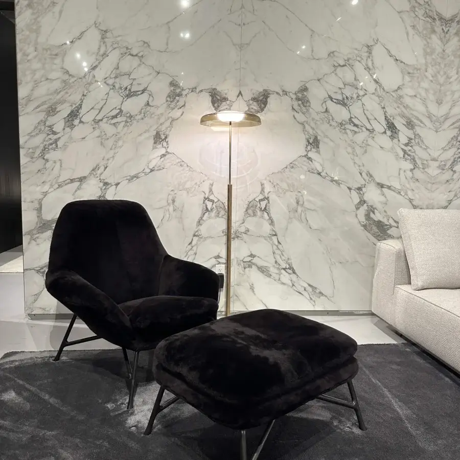 Elegant Oluce Dora floor lamp with a gently curved silhouette crafted in polished satin gold metal