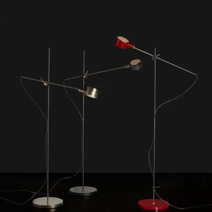 Exceptional Oluce G.O Floor Lamp with sleek metal construction and smooth red coating offering directed illumination