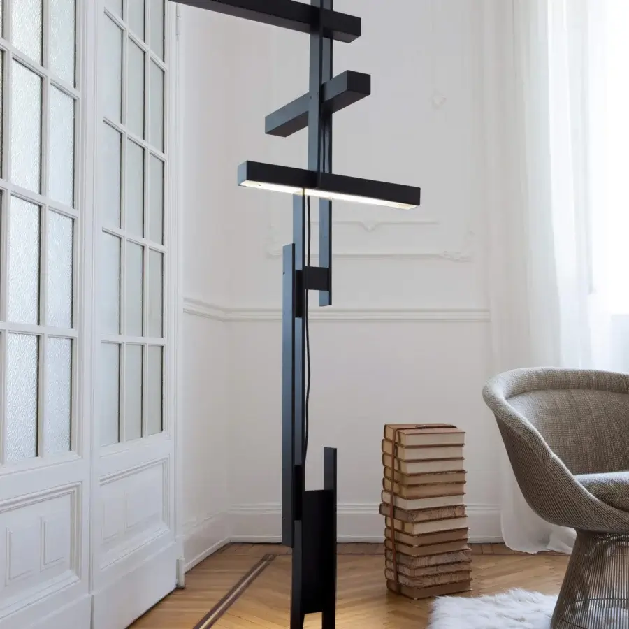 Elegant Oluce Las floor lamp crafted in aluminum with matte black finish delivers diffused and focused LED illumination