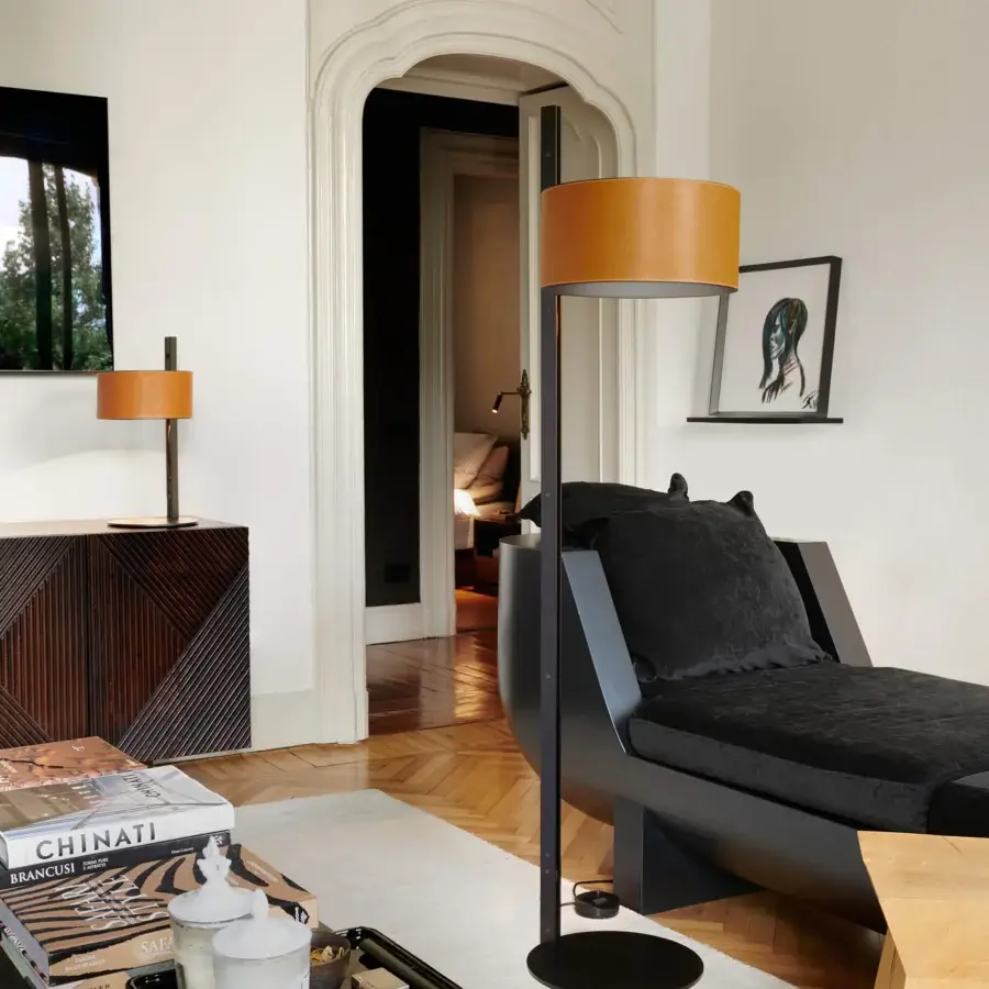 Architectural Oluce Parallel floor lamp with a matte black metallic structure and warm hammered leather lampshade