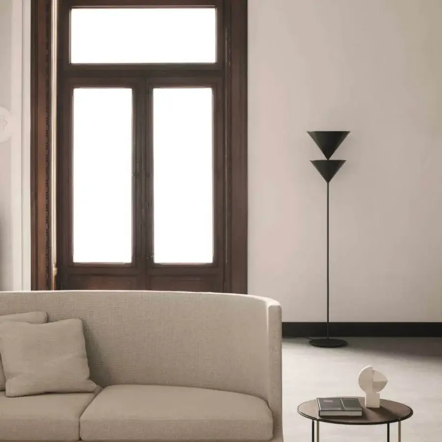 Superior Oluce Pascal floor lamp crafted in matte black metal with stacked conical shades and a slender silhouette